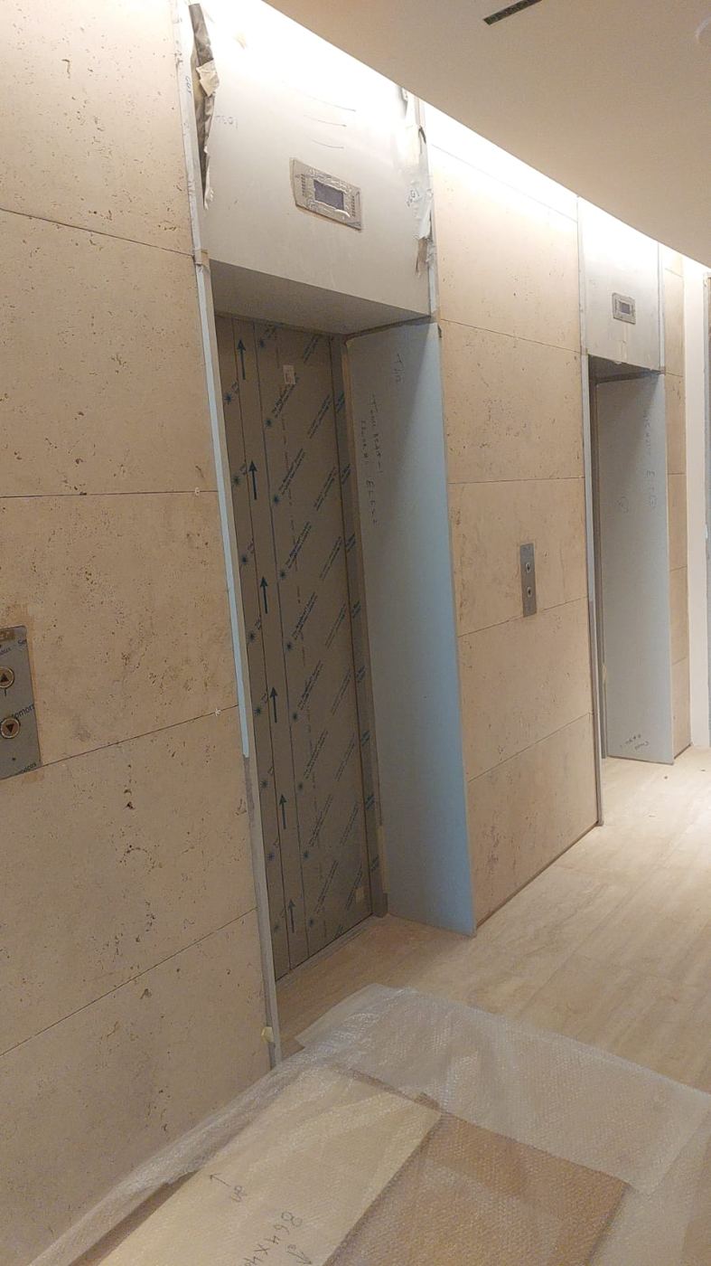 Stone-clad lift lobby